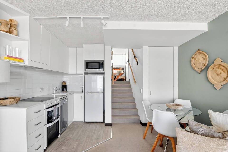 Prepare everything from quick breakfasts to casual meals in a bright, streamlined kitchen equipped for easy holiday living.