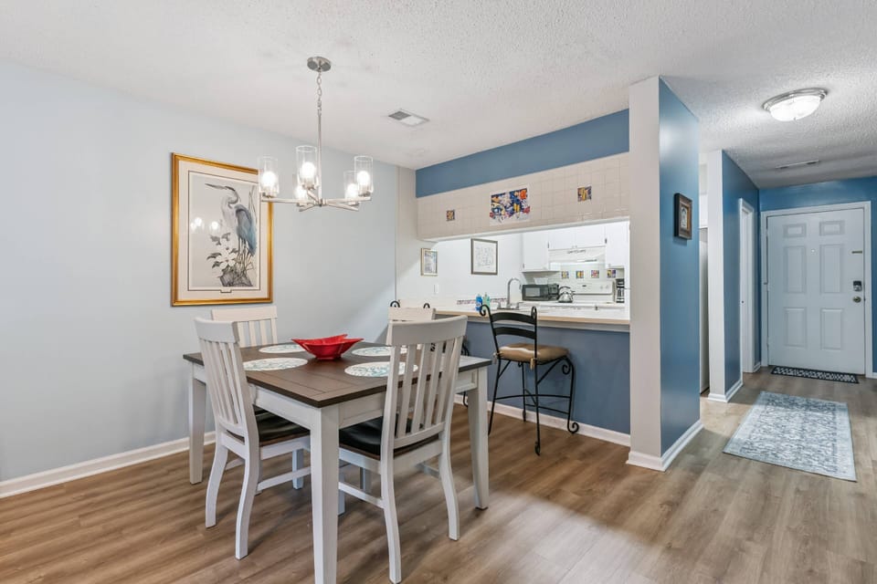 Enjoy meals at this 4-person dining table and 2 bar stools just off of the kitchen.