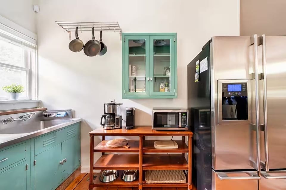 Fully equipped kitchen with a coffee station.