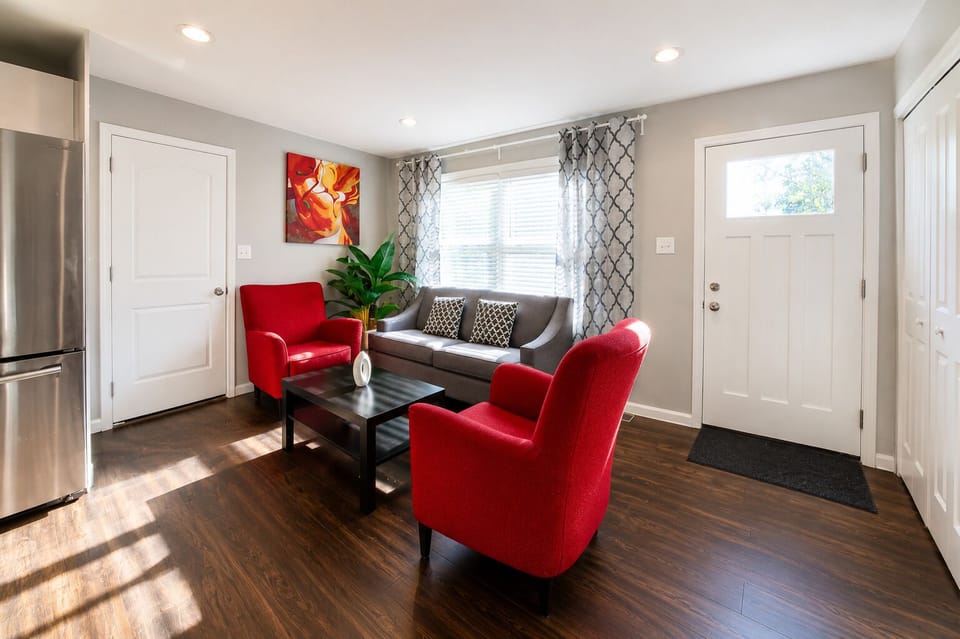 Bright modern living room with bold accents and plenty of natural light