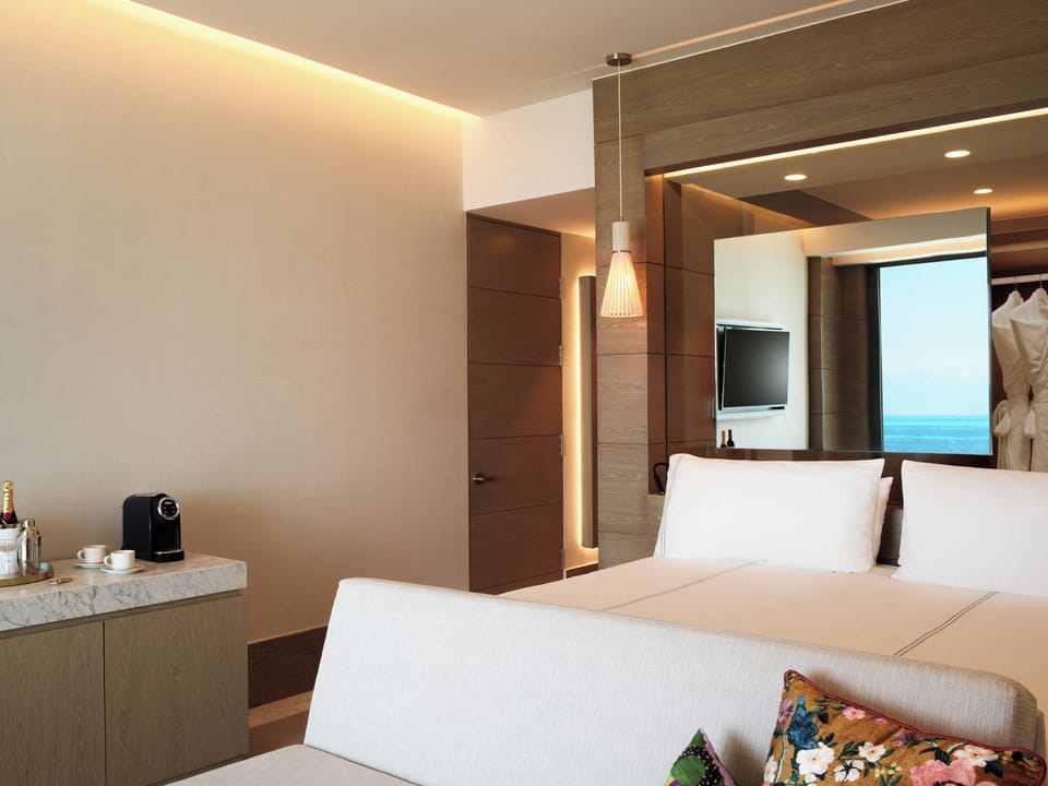 Settle in with in-room espresso and soft ambient lighting.