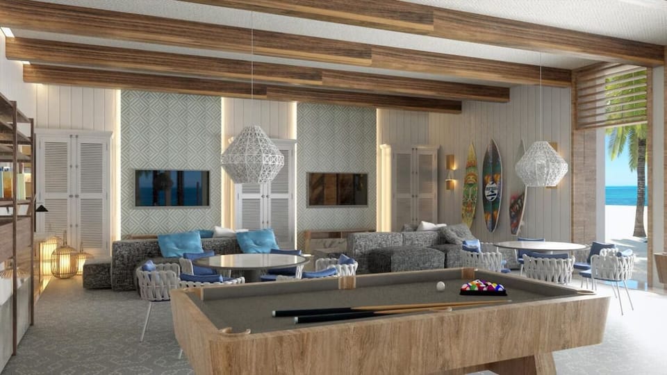 Challenge friends to a game of pool by the beach.