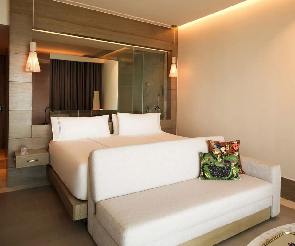 Sink into crisp linens and unwind in serene, modern comfort.