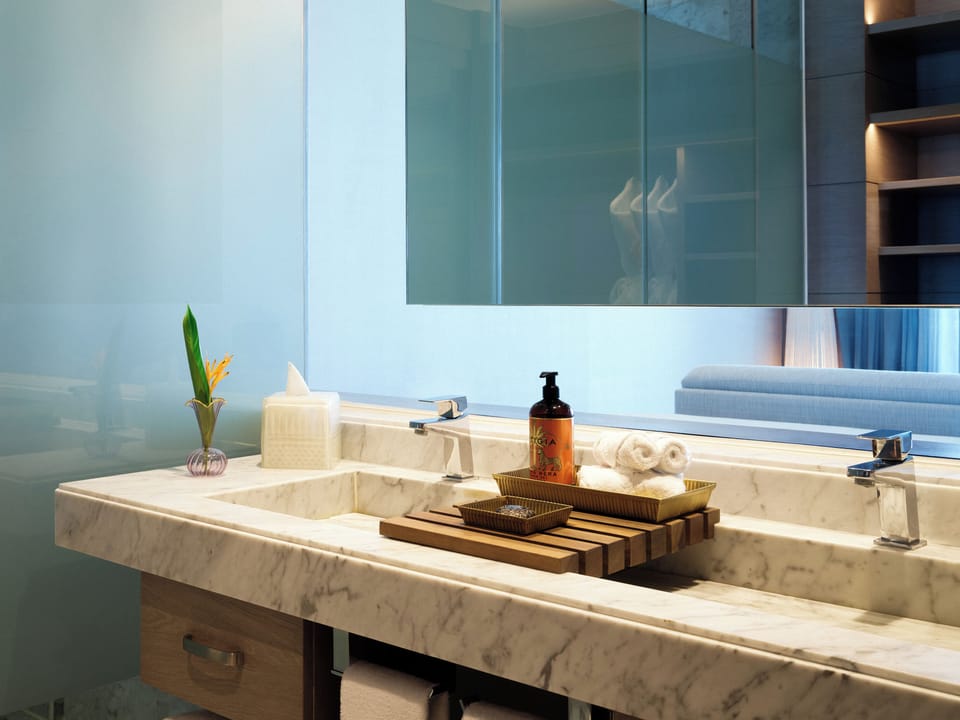 Refresh at a spa-like double vanity with luxe marble finishes.