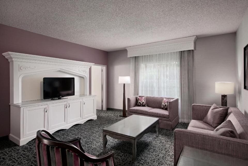 Unwind in a spacious sitting area with movie-night comfort.