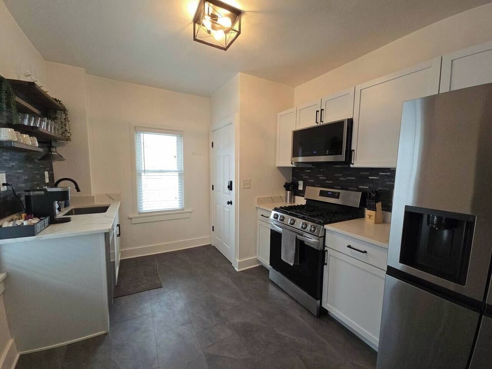 Bright modern kitchen with stainless appliances and stylish finishes