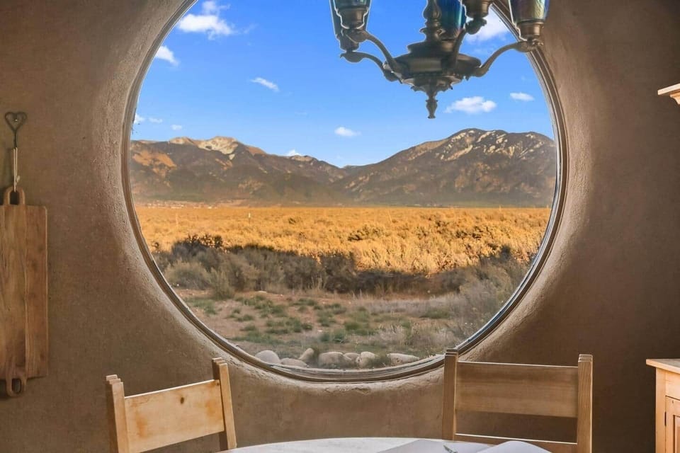 Iconic round picture window showcasing endless desert vistas