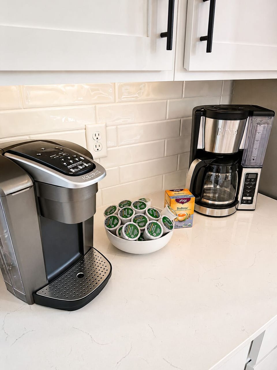 Bright kitchen coffee bar with Keurig, drip brewer, and stocked pods