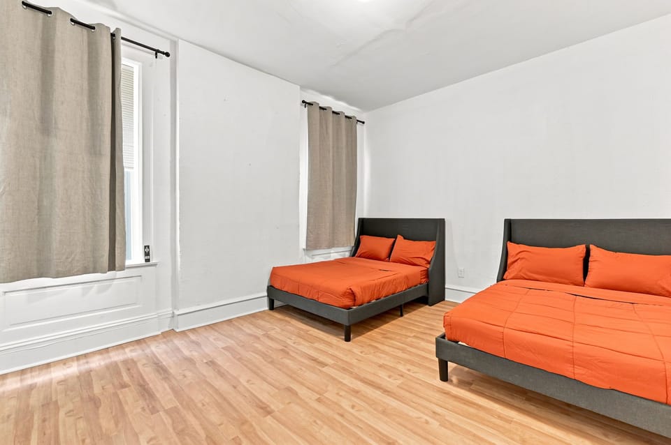 Spacious double-bed room with bright decor and plenty of natural light