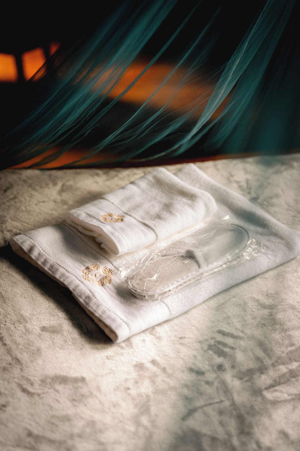 Plush towels, fresh slippers & dreamy canopy—spa-like comfort.