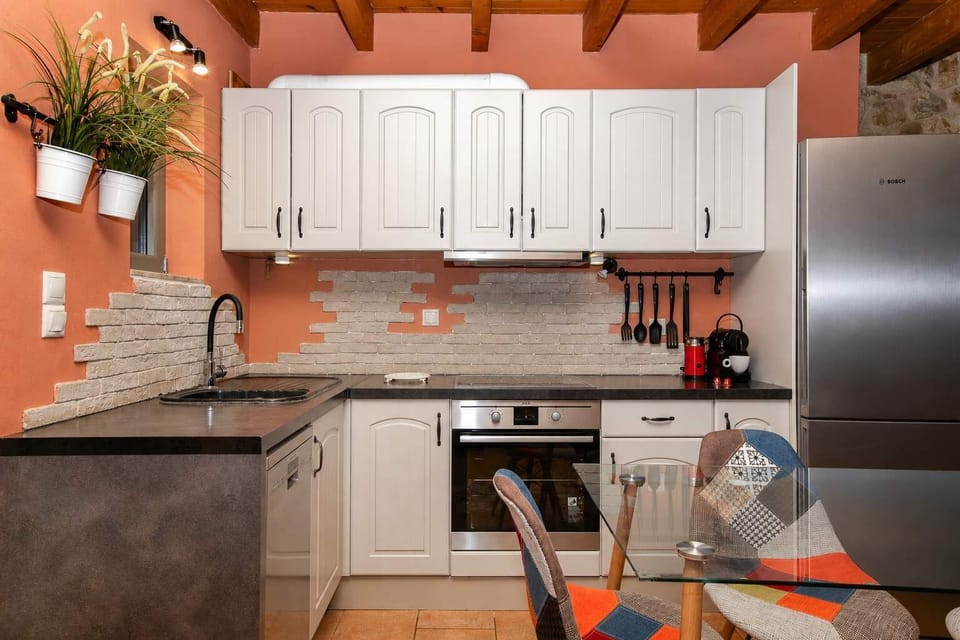 Traditional kitchen combining rustic character with modern conveniences for everyday cooking.