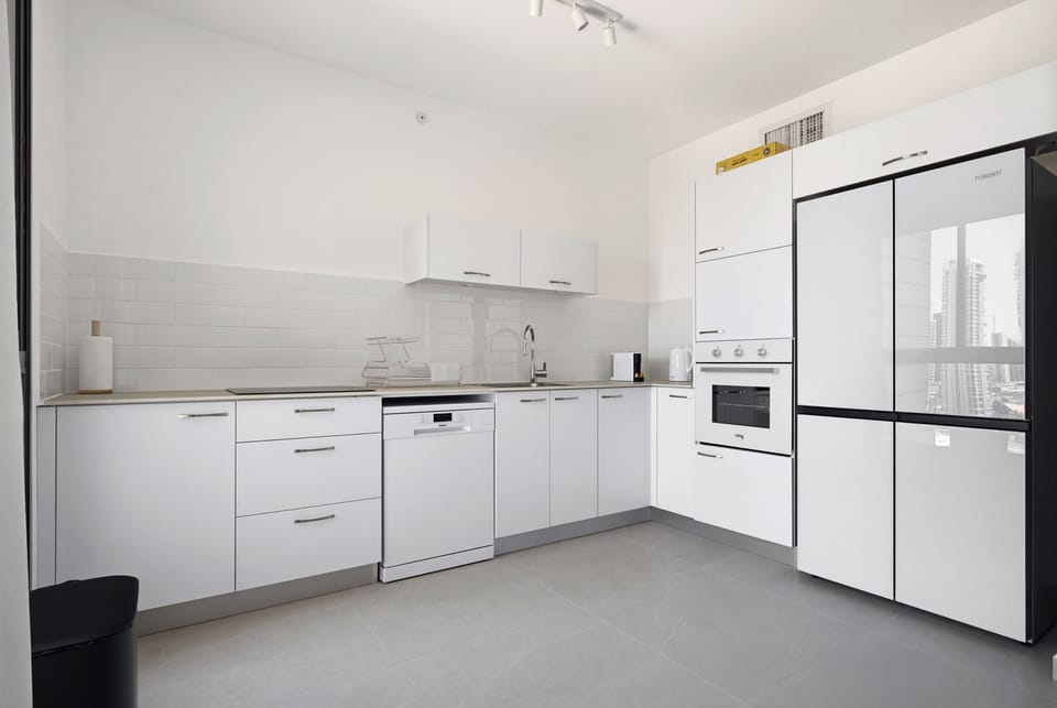 Prepare gourmet recipes with ease inside the sleek, modern culinary hub utilizing superb integrated appliances.