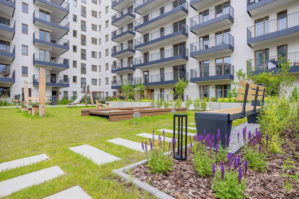 Beautifully maintained outdoor area with greenery and walking paths.