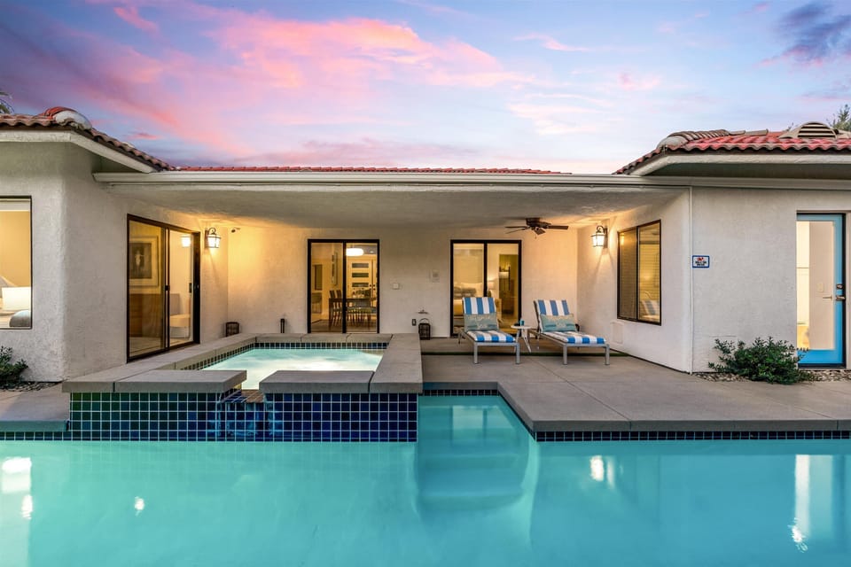Evening pool views with outdoor lighting