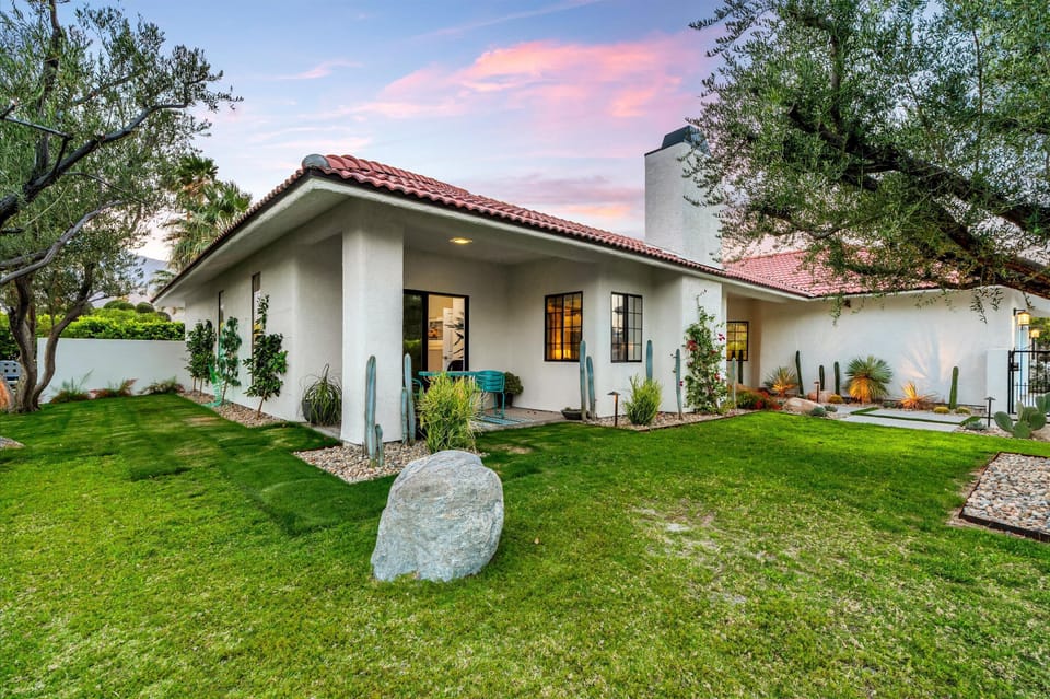 Twilight exterior highlighting the backyard