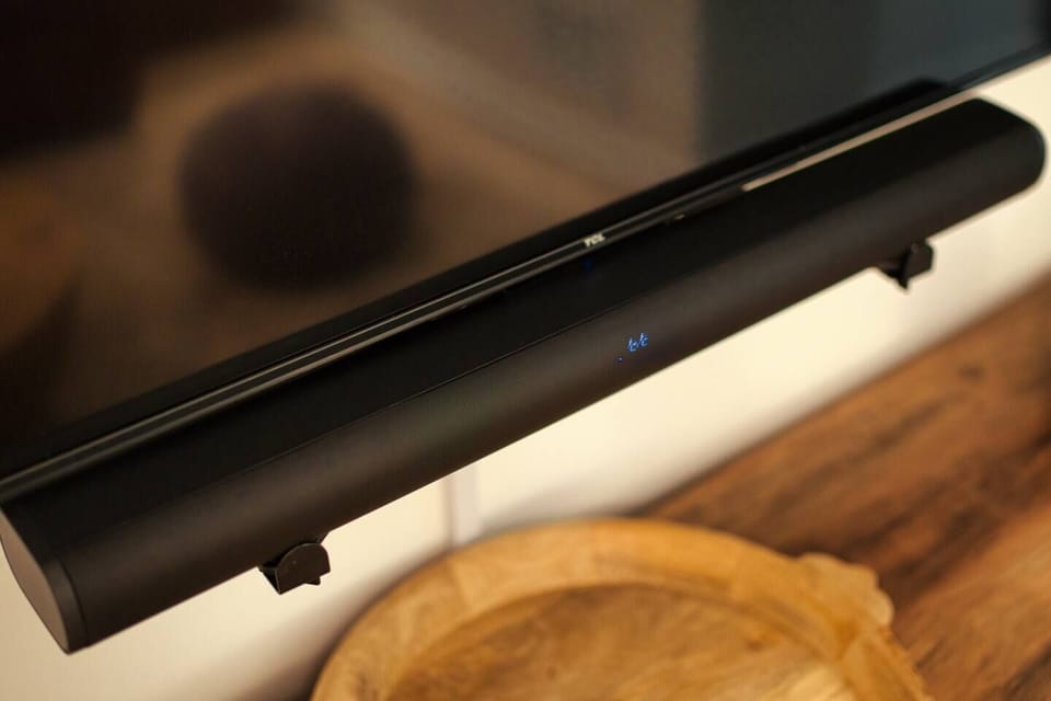 The living room entertainment center includes a sound bar connected to the TV and also allows you to stream your own media via Bluetooth.