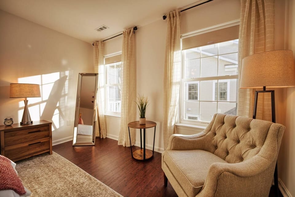If you are looking for comfortable, sunny quiet nook to read in, look no further than the chair nestled into the window area.