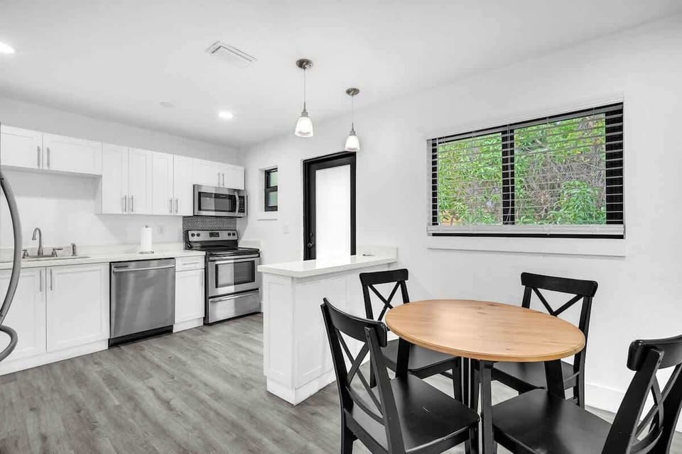 Bright, modern kitchen with everything you need, plus a cozy dining space perfect for meals or morning cof