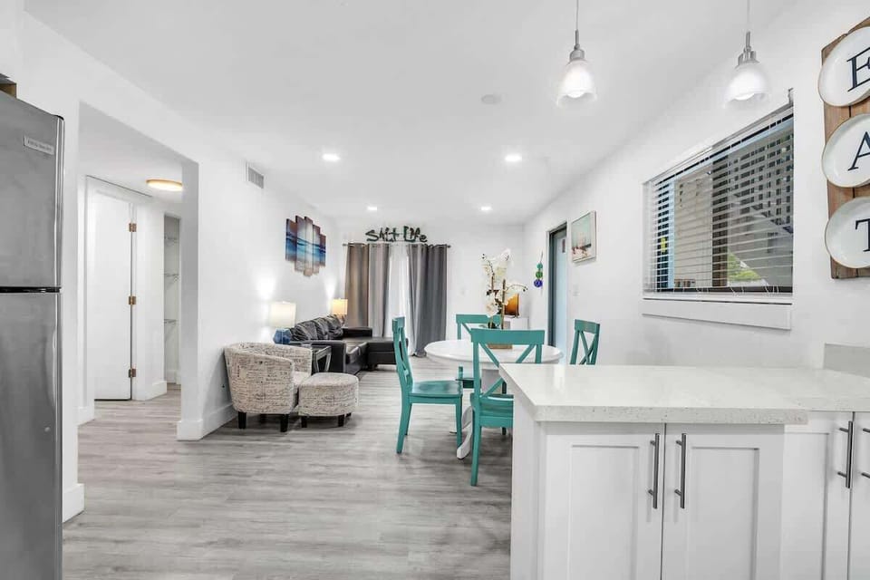 Enjoy the spacious flow between the kitchen, dining area, and living room, creating a comfortable setting for families, couples, and small groups.