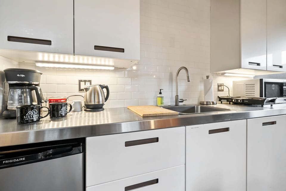 Your fully equipped kitchen features sleek stainless counters, modern appliances, and everything you need to prepare your favorite meals, including a coffee maker for leisurely mornings at home.