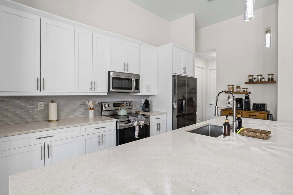 Cook in Style – This kitchen features high-end appliances, ample storage, and everything you need for a seamless culinary experience.


