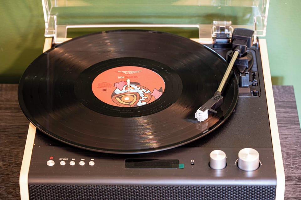 Vintage record player adds a cozy, retro vibe to the space