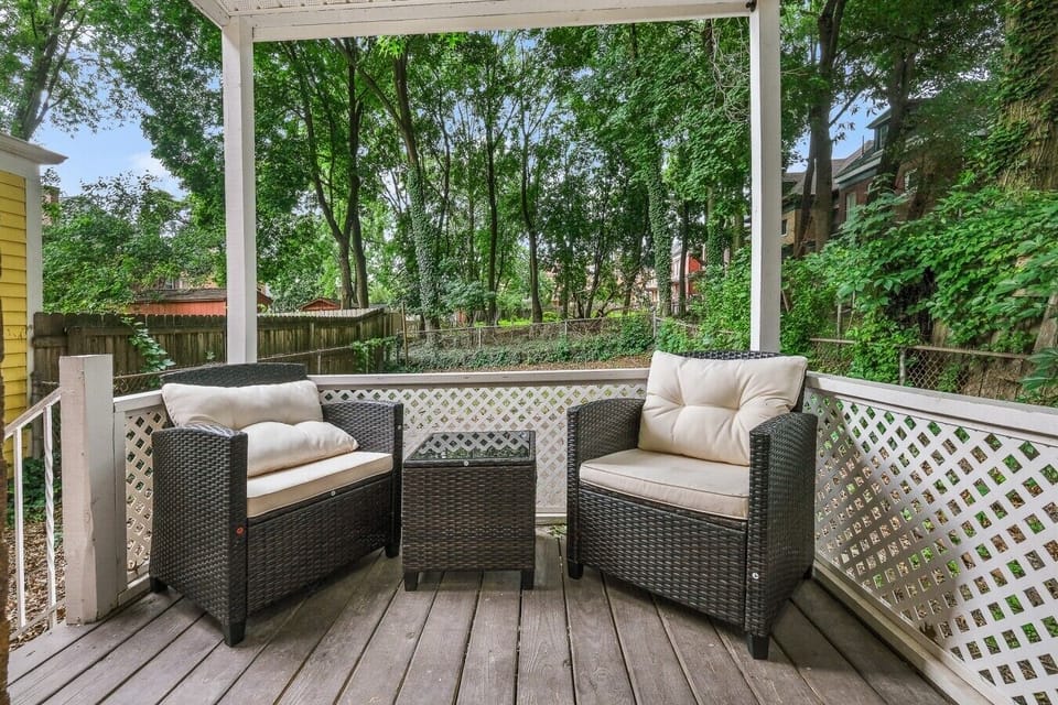 Enjoy a peaceful moment on the private patio surrounded by greenery — the perfect spot for your morning coffee or an evening drink.