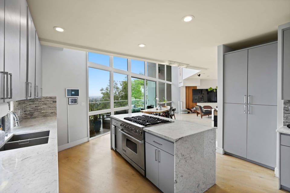 Bright kitchen with panoramic city views 🌆🍳