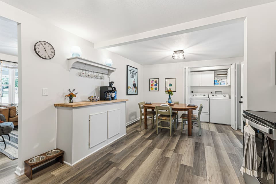 Bright dining space with coffee bar and in-home laundry access