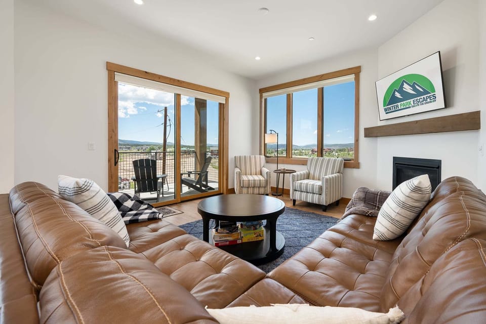Living Room W/ Gas Fireplace and 55" Smart TV