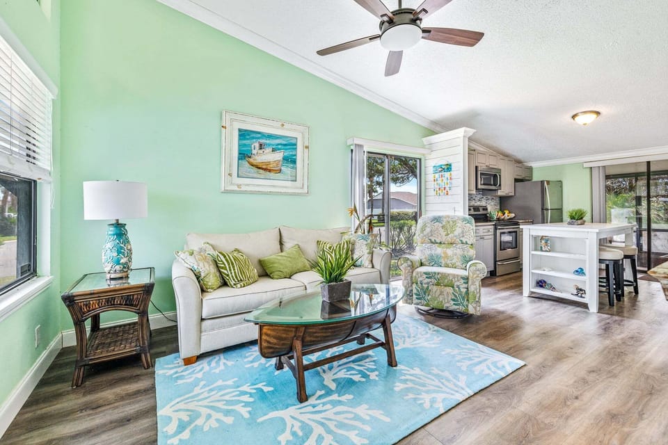 Bright, airy, and beautifully updated—this inviting living space is perfect for making memories with family and friends after a day in the Florida sunshine.