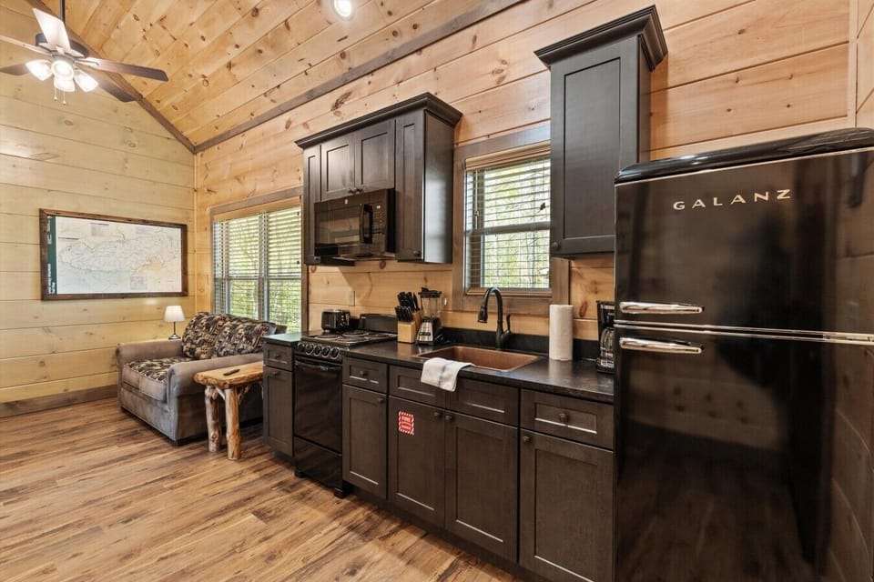 Full kitchen with stove, refrigerator, drip coffee maker