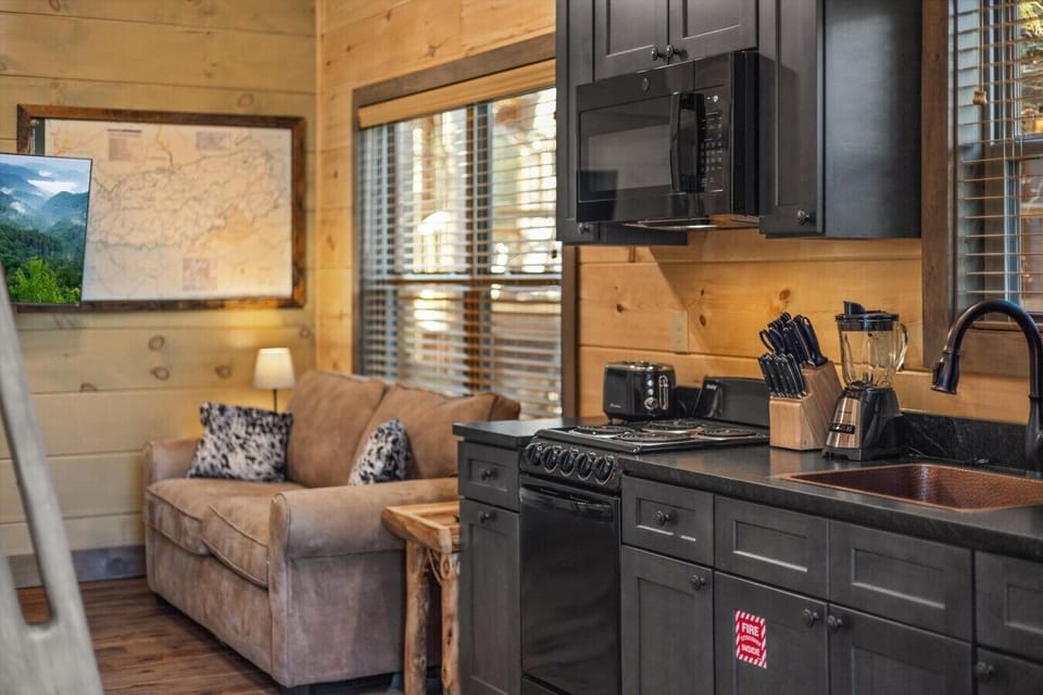 Full kitchen with stove, refrigerator, drip coffee maker