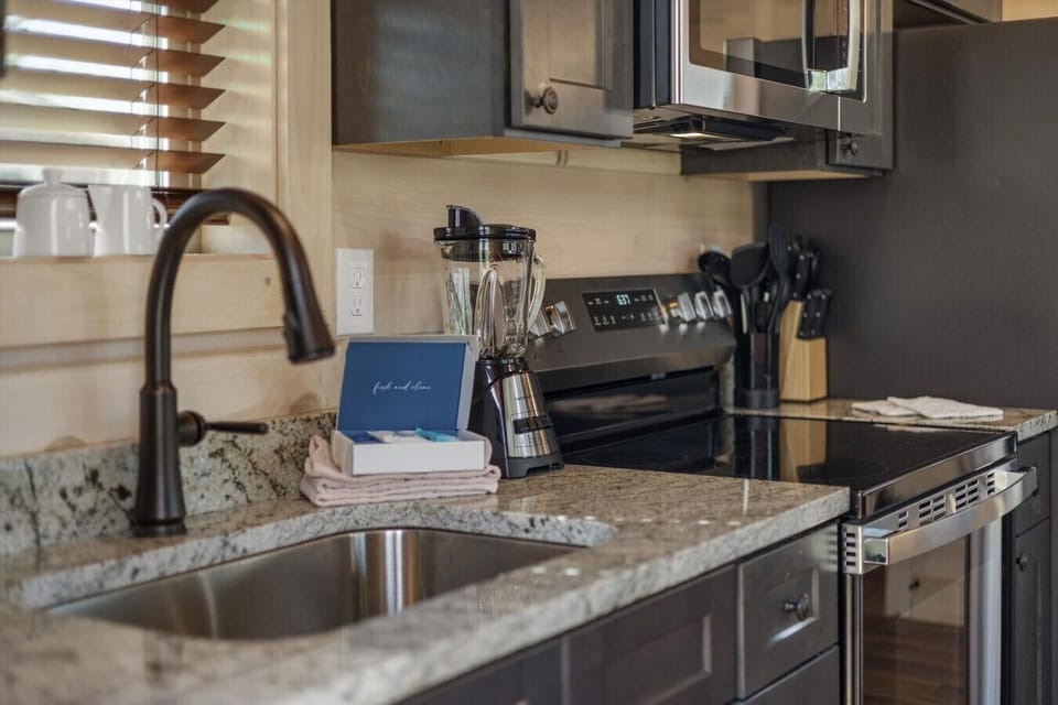 Full kitchen with stove, refrigerator, drip coffee maker