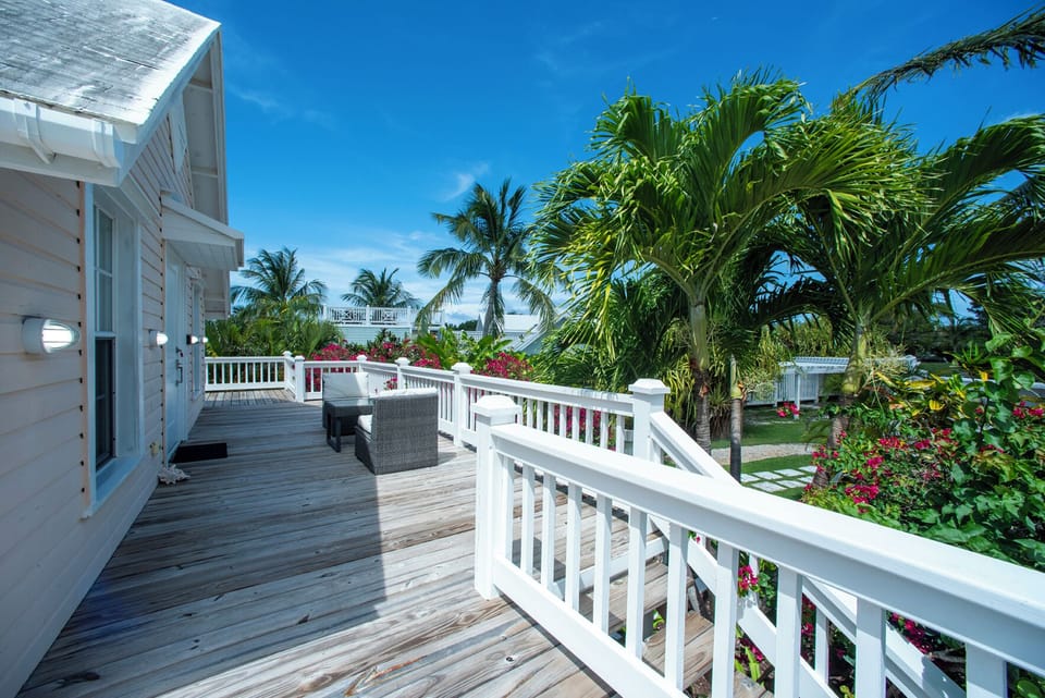 The veranda, furnished for lounging and dining, is ideal for morning coffee or evening cocktails.