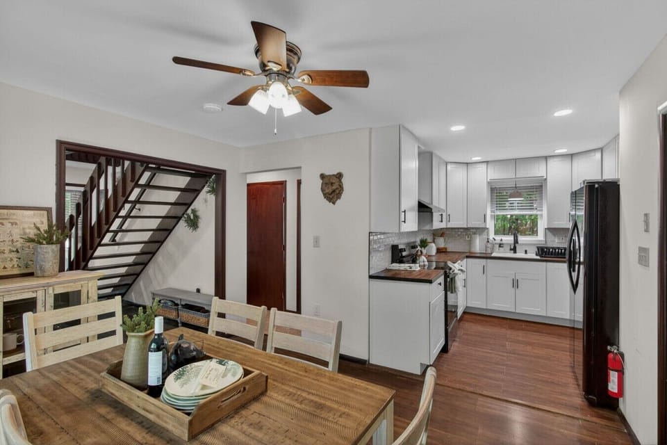 Bright dining and kitchen area designed for easy meals, coffee, and gathering before your Pocono adventures.