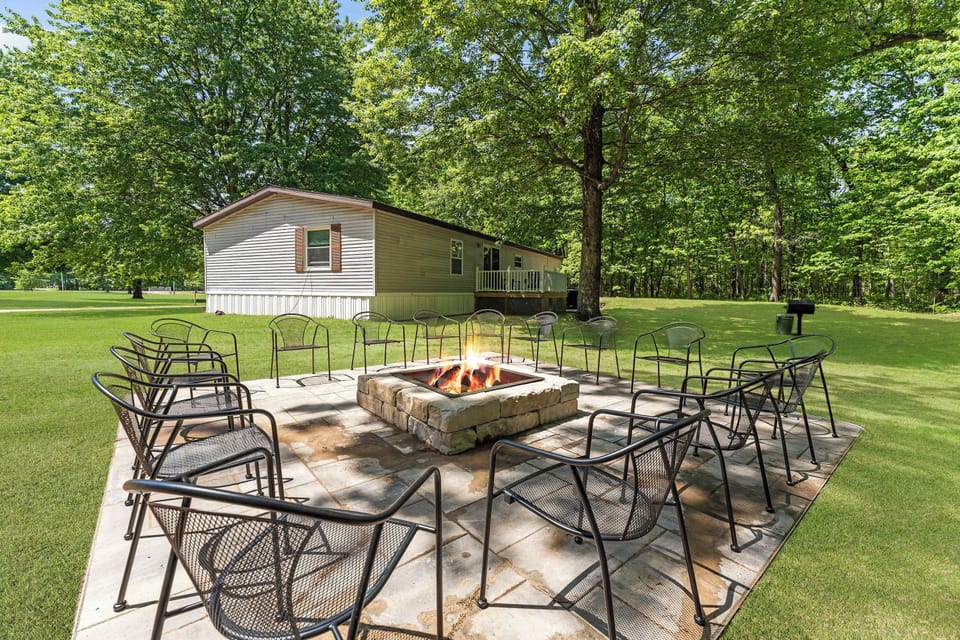 Gather around the Home Field Hideaway paved and polished fire pit for a glass of wine or a round of s'mores.