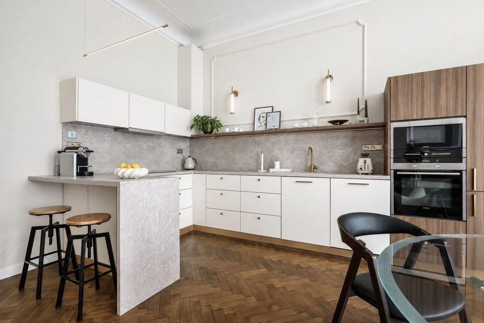 Elegant modern kitchen with breakfast bar and warm designer finishes