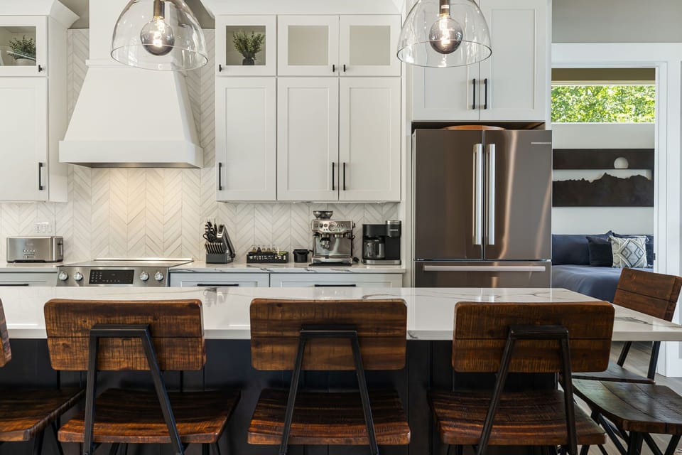 Main Level - Chef's Kitchen w/ Stainless Steel Appliances & Breakfast Bar Seating