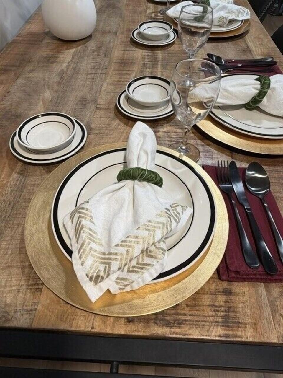 Elegant dining table setup with rustic charm and stylish place settings