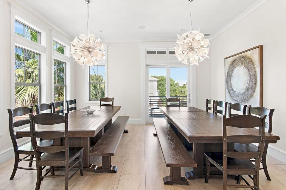 Bright, spacious dining with balcony access. Seats 20 +