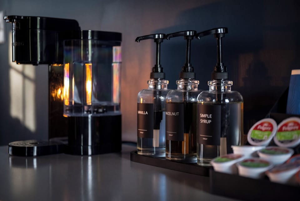Modern coffee station with syrups and pods for an elevated guest experience