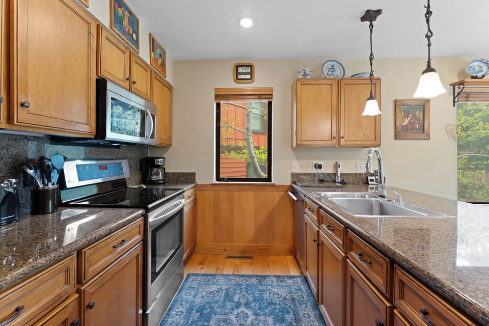 Prepare your favorite meals in this bright, well-equipped kitchen with stainless appliances and everything you need for easy cooking during your stay.