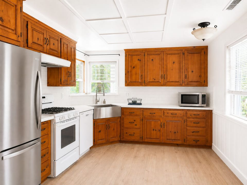 Large kitchen with new countertops and back splash and new flooring