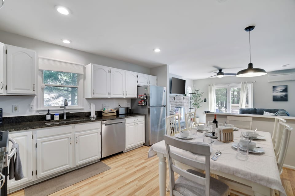 Bright open kitchen and dining space with natural light and room to gather