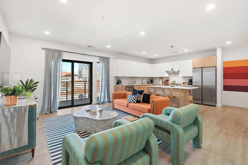 Living area with Smart TV and balcony access