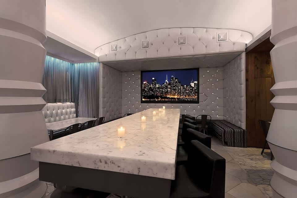Sip and socialize around the marble table in cozy comfort.