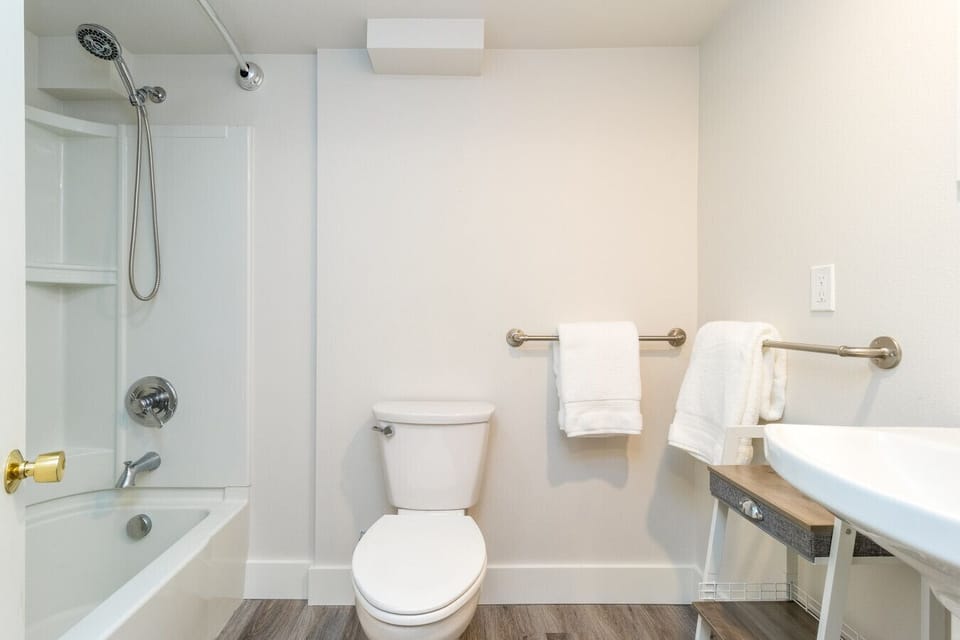 Full bathroom with tub shower in lower level