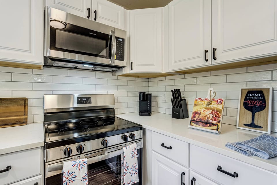 The updated kitchen is fully equipped for both short and extended stays and includes a Keurig coffee maker to help start your mornings right.