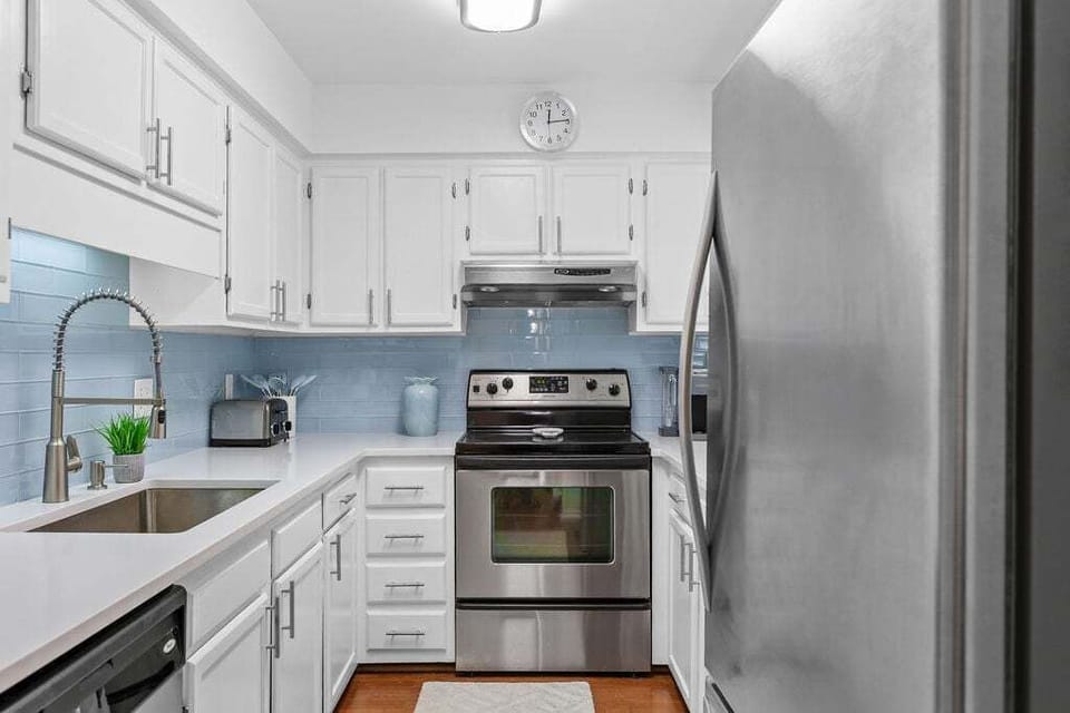 Full stocked kitchen with stainless steel appliances